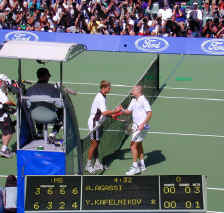 Kafelnifov and Agassi shake with score.JPG (104658 bytes)